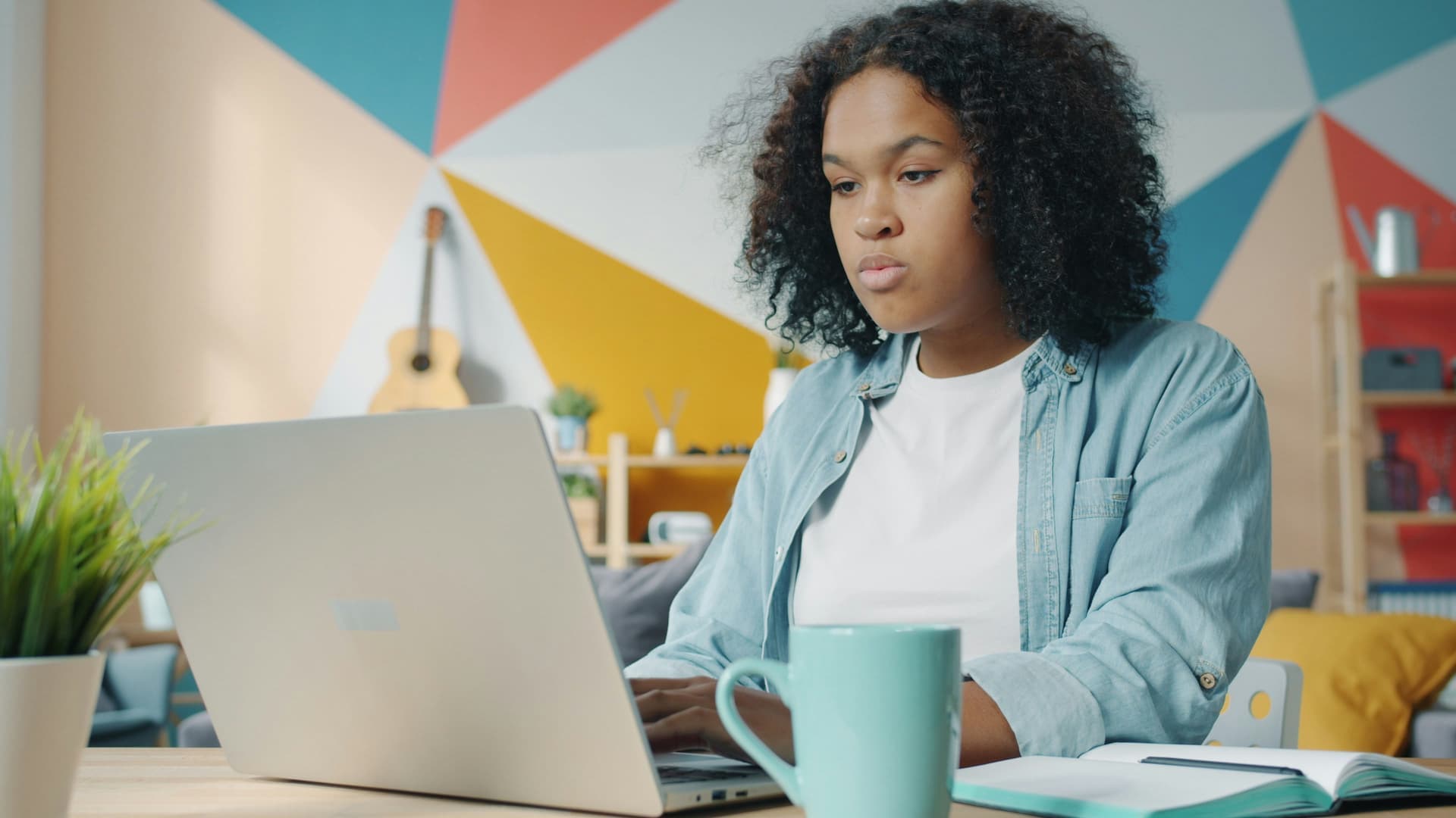 A professional reviewing AI readiness assessment results on a laptop in a modern UK office